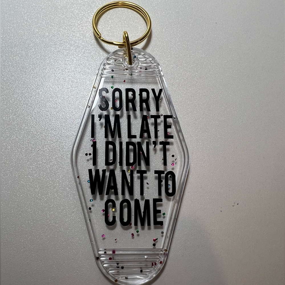 “Sorry I’m Late I Didn’t Want To Come” keychain with confetti/sparkle background